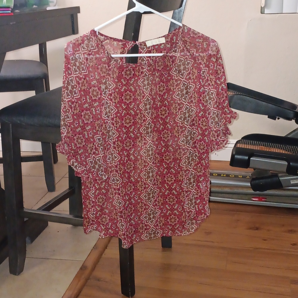 See-through red blouse with pattern design